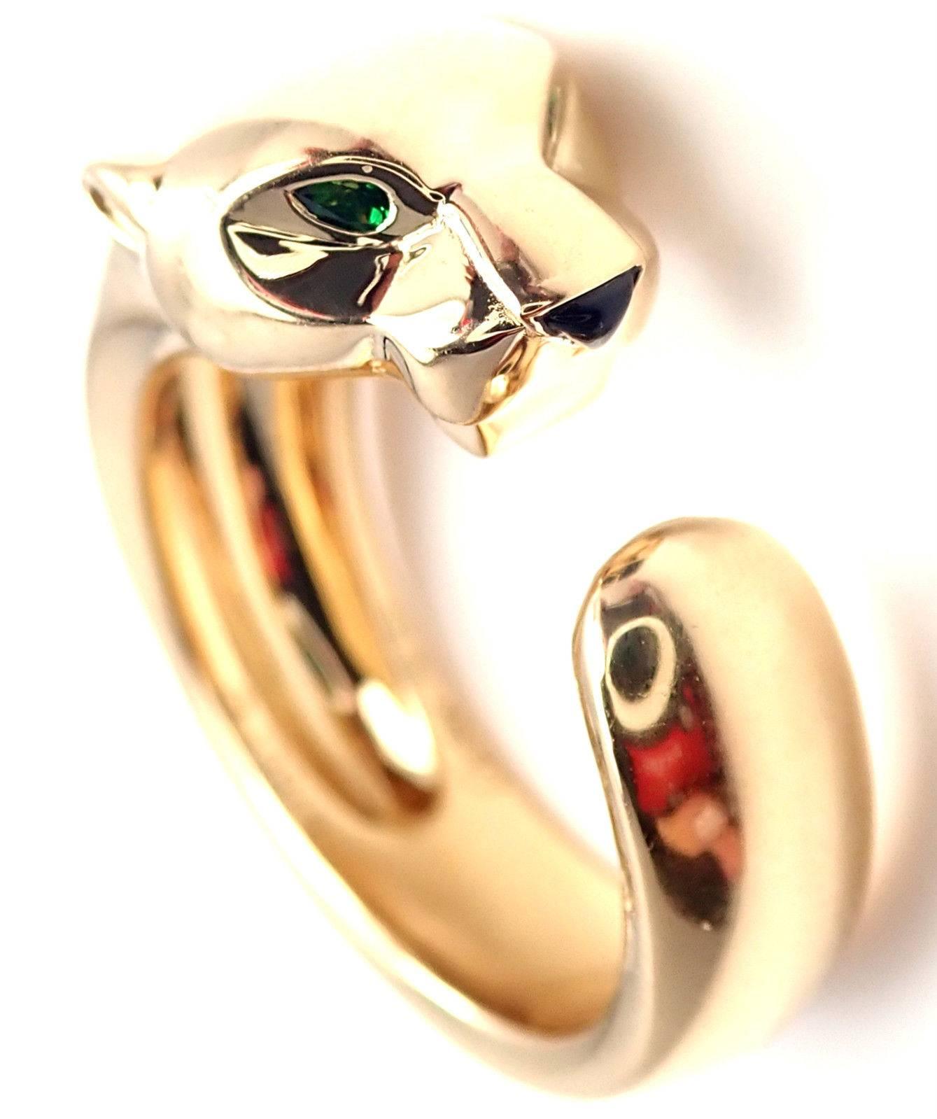 18k Yellow Gold Tsavorite Garnet and Onyx Panther Panthere Ring by Cartier. 
Part of the Panthere collection. 
With 2 small tsavorite garnets in the eyes
1 black onyx in the nose
This ring comes with original Cartier box.
Details: 
Ring Size: