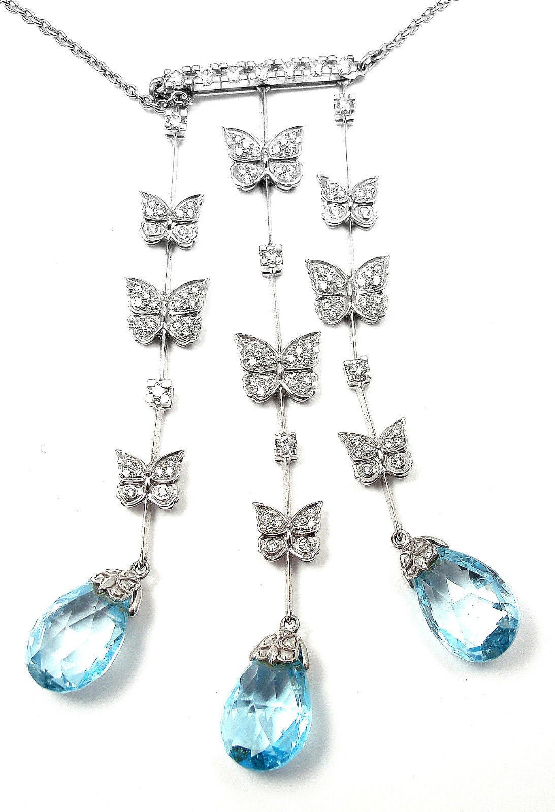 18k White Gold Baile Mariposa Butterfly Diamond Topaz Necklace 
by Carrera Y Carrera.

With 104 round cut diamonds VS1 clarity, G color total weight approx. 1.17ct
3 Pear Shape Blue Topaz total weight approx. 17.39ct
This necklace comes with