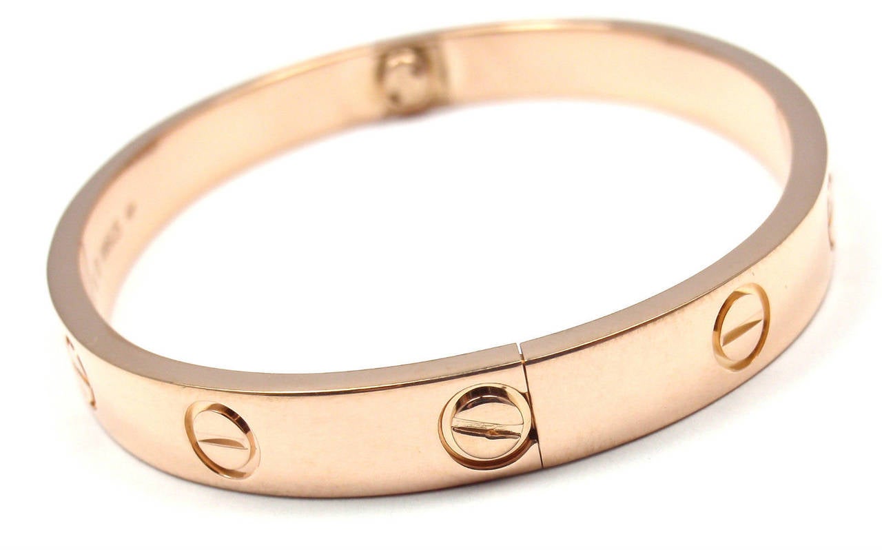 18k Rose Gold LOVE Bangle Bracelet by Cartier. Size 16. 

This beautiful Cartier Love Bangle comes with an original Cartier box 
and a Screwdriver.
This bracelet has a new screw system.

Details:
Weight: 30.9 grams 
Width: 6.5mm
Stamped