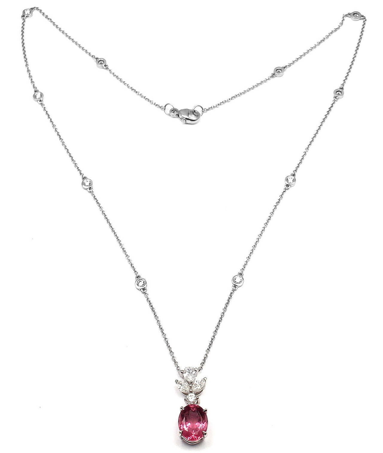 Platinum Diamond and Pink Tourmaline Necklace by Tiffany & Co. 
With 2 marquise shaped brilliant cut diamonds,   11 round shape brilliant cut diamonds and 1 pearl shape.

t/w = .61ct  VS1 clarity F color
1 oval pink tourmaline approx.