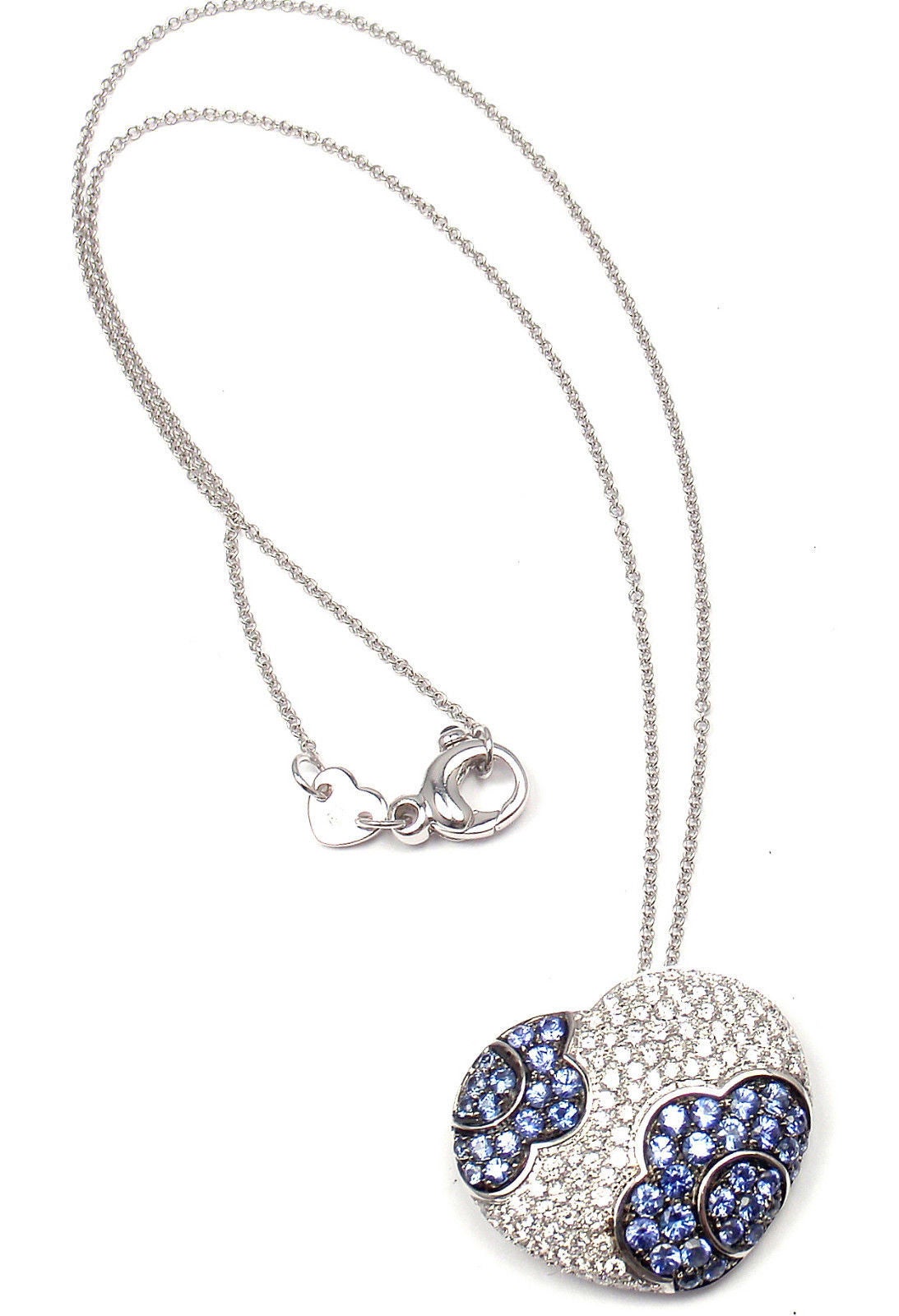 18k White Gold Petals Diamond And Sapphire Heart Necklace by Pasquale Bruni. 

With round brilliant cut diamonds total weight approx. 1.24ct Sapphires 1.85ct
This necklace comes with Box, Certificate and Tag.

Details:
Length: 17.5