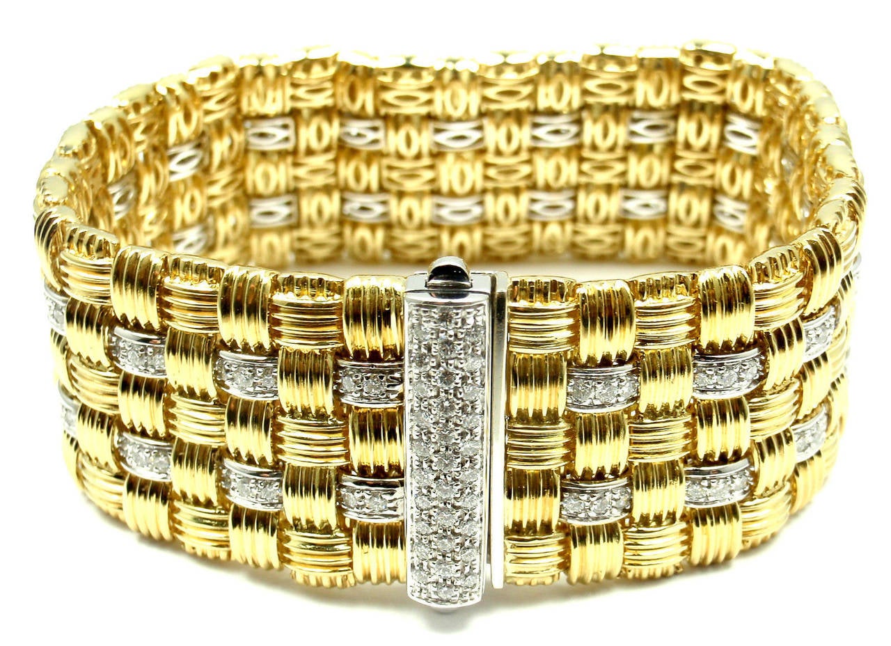 18k Yellow Gold Diamond Appassionata Wide 5 Row Bracelet by Roberto Coin.
With 145 brilliant cut diamonds SI1 clarity, H color total weight approx. 2.5ct
1 ruby

Details:
Weight: 81.6 grams
Length: 7