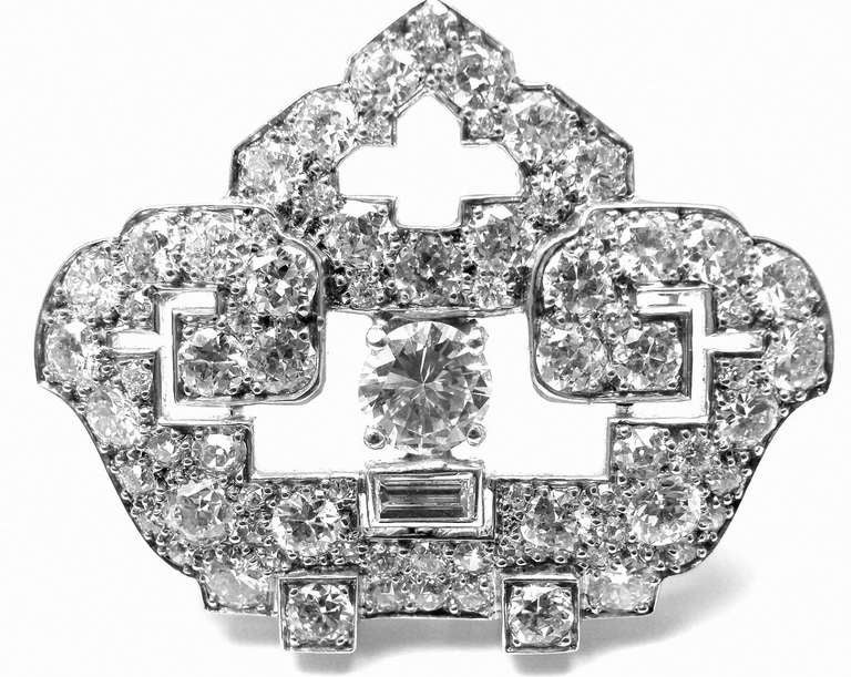 Platinum Art Deco Diamond Pendant Pin Brooch by Cartier. This pendant/brooch comes with an original Cartier box. With 64 round old European cut gem quality diamonds, VS1 clarity, E color. Total Diamond Weight: 5CT. 

Details: 
Measurements: 35mm