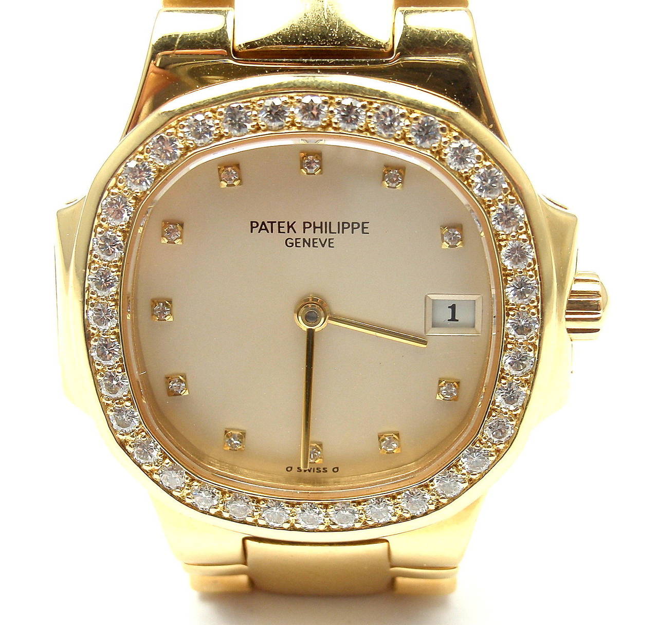 Patek Philippe Ladies 18k yellow gold and diamond Nautilus wristwatch, Ref. 4700.  This watch comes with Patek Philippe box and Certificate of origin 
from Patek Philippe.

Patek Philippe Nautilus in 18k yellow gold. Reference: 4700/53. 
Watch