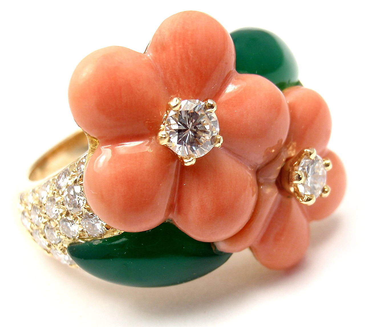 18k Yellow Gold Diamond Coral Chalcedony Flower Ring by Van Cleef & Arpels. With 34 brilliant round cut diamonds VVS1 clarity, F color
Total weight approx .80ct
2 coral flowers
2 green chalcedony leafs

Details:
Ring Size: 8 (resize