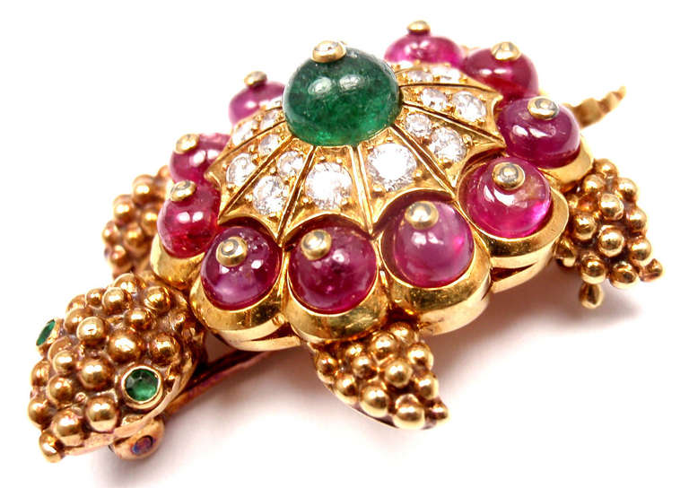 14k Yellow Gold Turtle Diamond, Emerald, and Ruby Brooch Pin by Van Cleef & Arpels. 
With 18 round brilliant cut diamonds VVS1 clarity, E color 
total weight approx. .50ct
1 round emerald total weight approx. .50ct
11 round ruby total weight