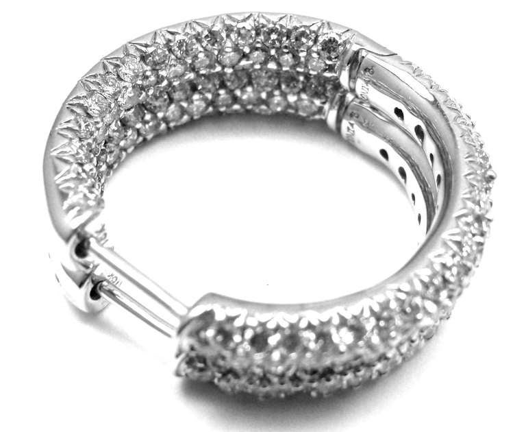 SONIA B. BITTON 18K WHITE GOLD DIAMOND HOOP EARRINGS

Metal: 	18k White Gold
Diameter:  28mm x 26mm
Weight:   13 grams
Stones: 198 round brilliant cut diamonds VS2 clarity, G color. 
Total weight approx. 4ct
Hallmarks: 	Sonia B. 18k

YOUR