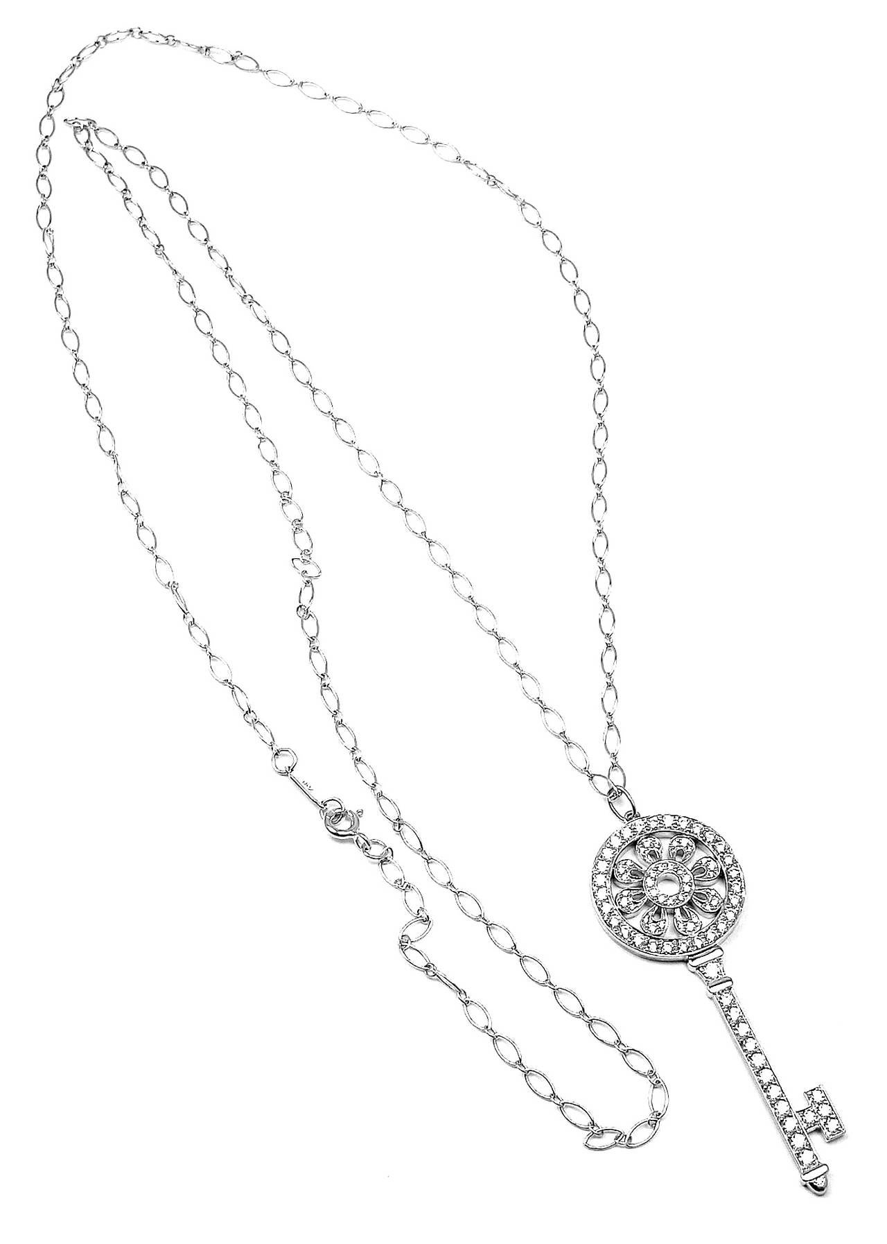 Platinum & 18k White Gold Diamond Petals Key Pendant Necklace by 
Tiffany & Co.
With 80 round brilliant cut diamonds VS1 clarity, G color total weight 
approx. 1.09ct

Details:
Weight: 14.4 grams
Length: 30