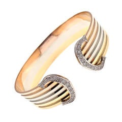 Bracelet double C en or tricolore avec diamants Cartier