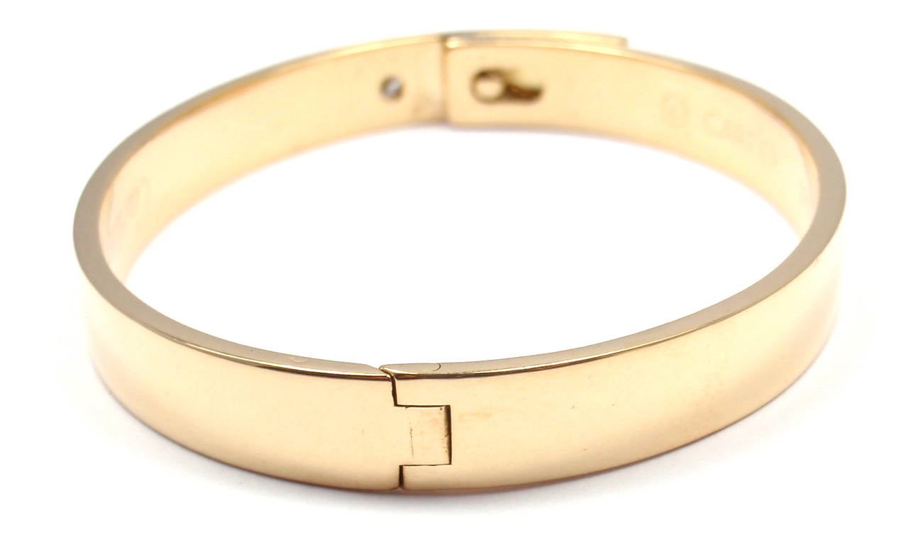 18k Yellow Gold Diamond Anniversary Bangle Bracelet By Cartier. 
Size 16. 
This bracelet comes with an original Cartier box and Cartier certificate. 
With 1 round brilliant cut diamond VS1 clarity, G color total weight .10ct

Details: 
Size: