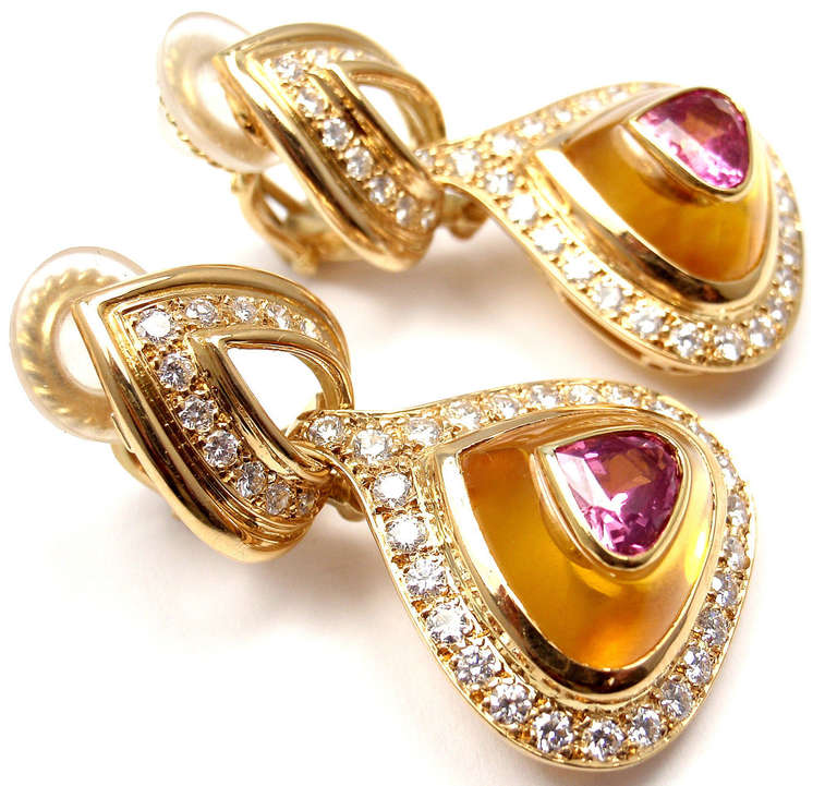 18k Yellow Gold Diamond Pink Sapphire and Citrine Earrings by Harry Winston. 
With 74 round diamonds approximately 2.5ct VVS1 clarity, E color.
2 pink sapphires 7mm x 6mm
citrines around the pink sapphires
These earrings are clips for non