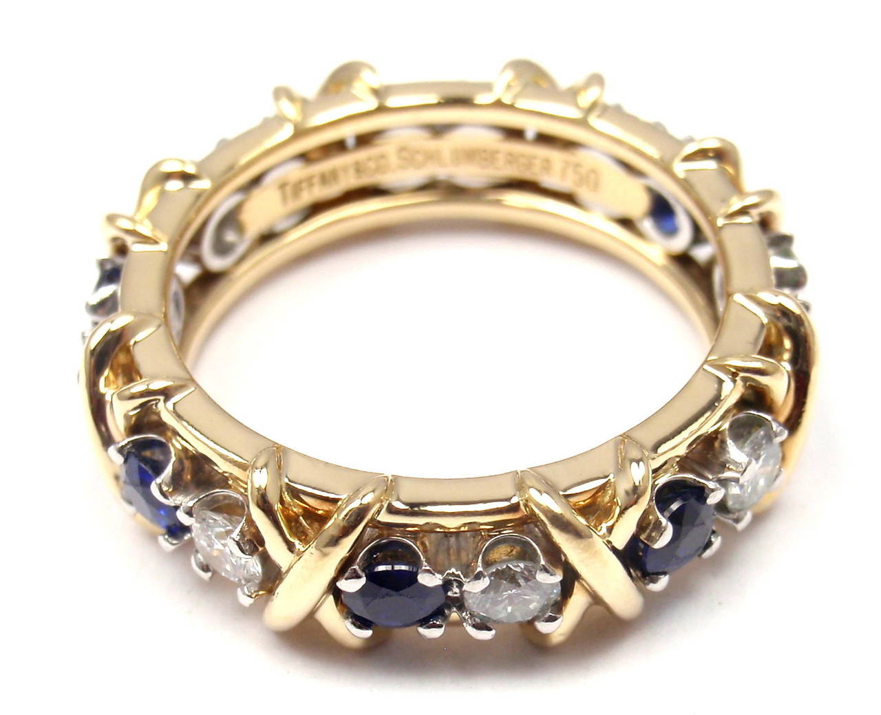 18k Yellow Gold & Platinum Diamond & Sapphire Jean Schlumberger Band Ring designed for Tiffany & Co. 

With 8 Round Brilliant Cut Diamonds VS1 clarity, G color, Total weight Approx .59ct and 8 round sapphires total weight approx.