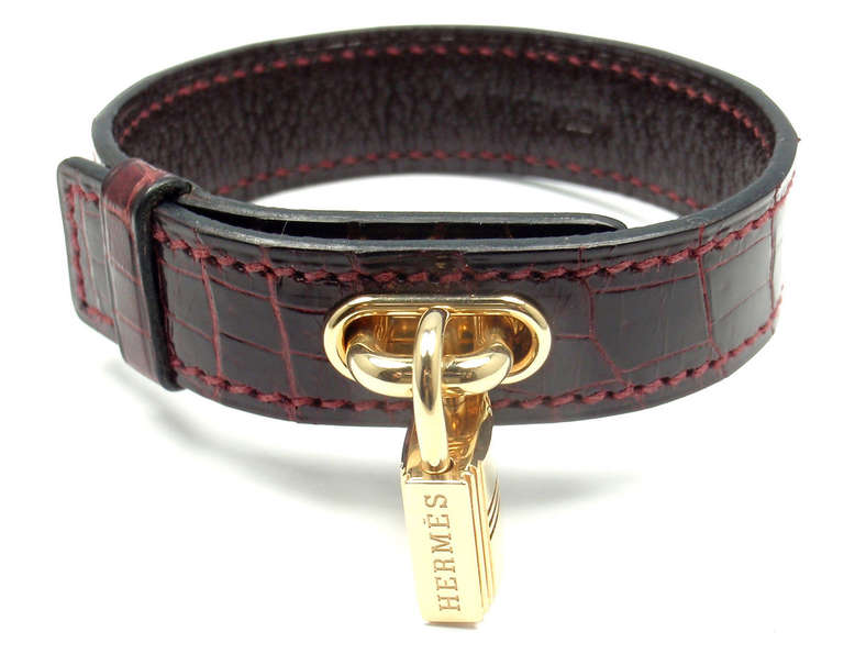 18k Yellow Gold Lock &  Crocodile Burgundy Bangle Bracelet by Hermes. 
This bracelet comes with an original Hermes box.

Details: 
Length: 7