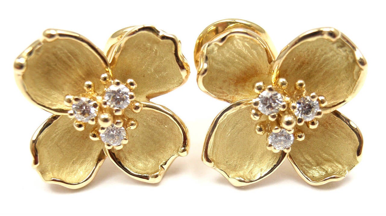 18k Yellow Gold Dogwood Flower Diamond Earrings by Tiffany & Co.
With 6 round brilliant cut diamonds VS1 clarity, G color 
total weight approx. .30ct

These earrings are made for pierced ears.

Details:
Weight: 11.3 grams
Dimensions: 18mm x