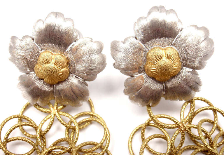 18k Yellow & White Gold Olympia Magnolia Flower Earrings by Buccellati.

Measurements: 
Length: 3 inches drop
Width: 3/4