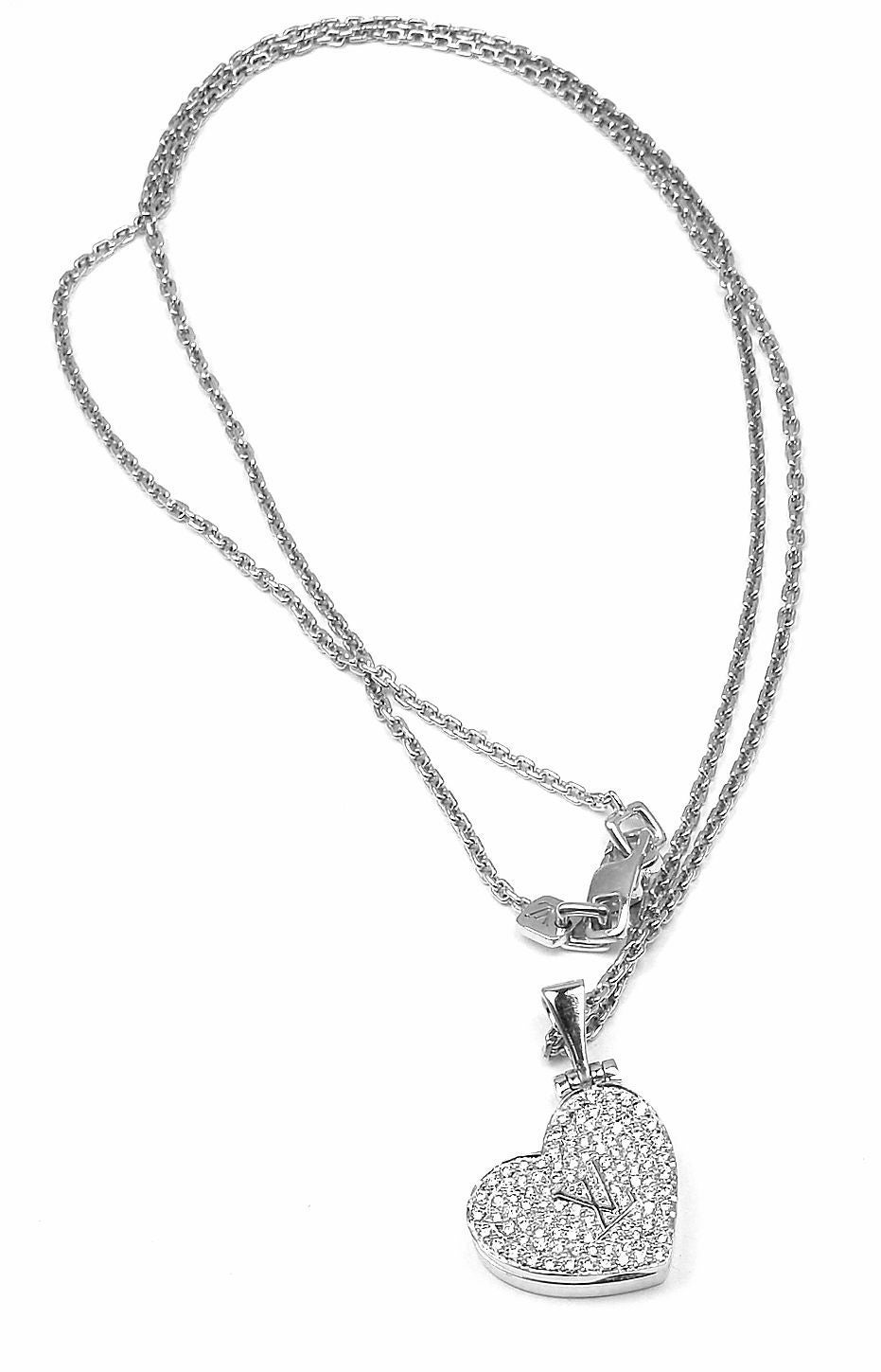 18k White Gold Diamond Heart Locket Pendant Necklace by Louis Vuitton. 
With 110 round brilliant cut diamonds VS1 clarity 
G color

Details:
Measurements: 1