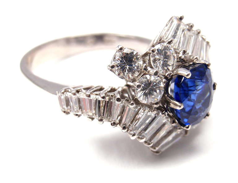 18k White Gold Diamond and Sapphire Ring by Bulgari. 
With 28 diamonds VS1 clarity, G color total weight approx. 1.30ct
1 sapphire 6.3mm x 5.2mm weight approx. 1.5ct

This ring also comes with its original Bulgari box. 

Details: 
Ring Size: