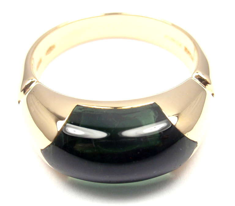 18k Yellow Gold Gold Green Tourmaline Band Ring by Bulgari. 
With 1 Green Tourmaline
Stone approx. 8mm x 15mm

Details: 
Ring Size: 6 1/2 (resize available)
Width: 8mm
Weight: 8.3 grams
Stamped Hallmarks: Bvlgari, 750, 2337AL

*Free