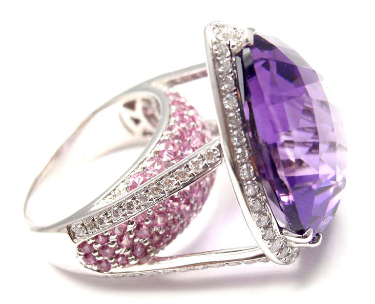 18k White Gold Diamond Amethyst Tourmaline Ring by Sonia B. Bitton. 
With 86 round brilliant cut diamonds SI clarity, G color total weight approx. .86ct
36 round pink tourmalines
1 large pear shape amethyst 
20mm x 17mm

Details: 
Ring Size: