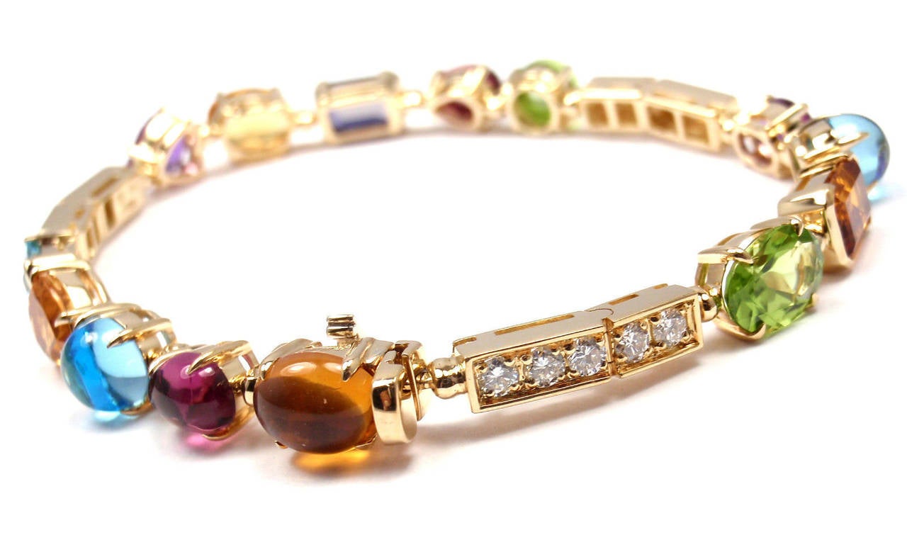 18k Yellow Gold Diamond & Gemstone Allegra Bracelet by Bulgari. 
With Pink Tourmalines(pink), Peridots(green),
Iolites(dark blue), Amethysts(purple), Palmeira Citrines(orange) & Blue Topaz(light blue)
15 round brilliant cut diamonds VS1 clarity,