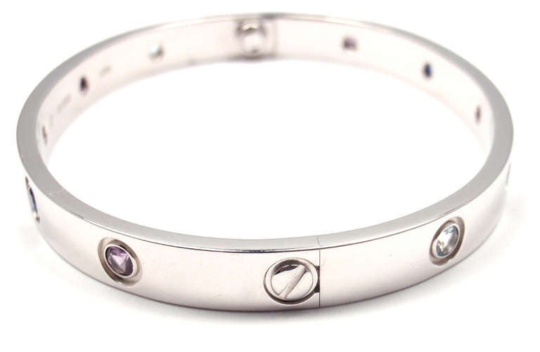 18k White Gold Color Stone LOVE Bangle Bracelet Size 17 by CARTIER. This beautiful bracelet comes with its original Cartier box and a screwdriver.
With 10 colored stones: purple spinel, blue and pink sapphires, amethyst, aquamarine.

This