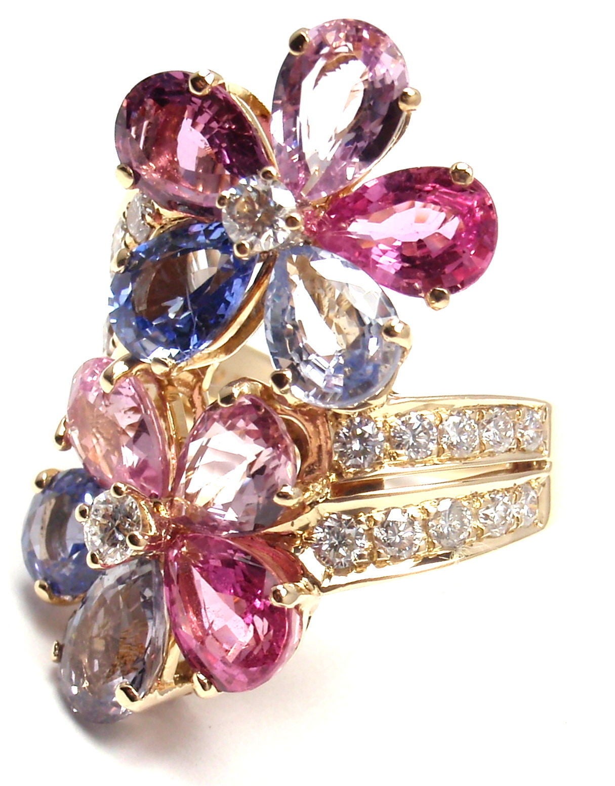 18k Yellow Gold Fancy Sapphire Flower Ring By Bulgari.
With 22 Round brilliant cut diamonds VVS1 clarity, E color
10 Fancy color Sapphires.
This ring comes with original Bulgari box.

Details:
Ring Size: 5.5 (resize available)
Width: