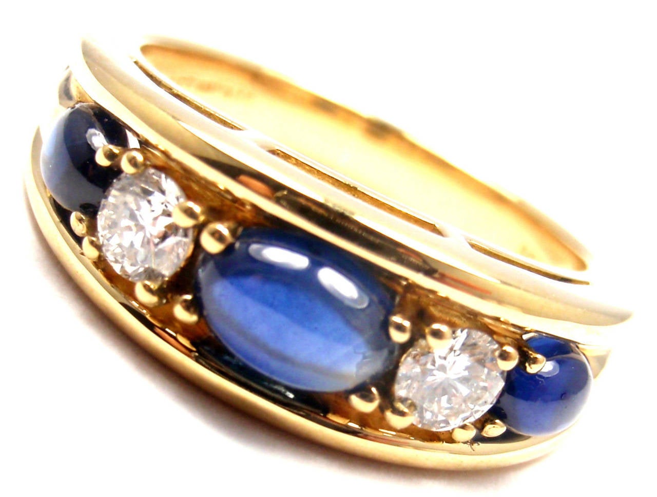 18k Yellow Gold Diamond And Sapphire Band Ring designed for Tiffany & Co.

With 2 round shape diamonds VS1 clarity G color
total weight approx. .30ct
3 sapphires total weight approx. 1ct

Details:
Ring Size: 6
Weight: 7.3 grams
Width: