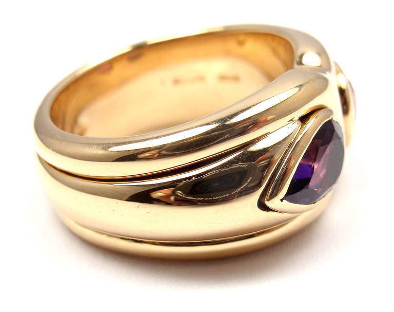 18k Yellow Gold Amethyst & Pink Tourmaline Ring by Bulgari. 
With 1 Pear shaped Amethyst 8mm x 6mm and 1 Pear Shaped Tourmaline 8mm x 6mm.
Details: 
Ring Size: 6 (resize available)
Width: 11mm
Weight: 16.1 grams
Stamped Hallmarks:  Bvlgari,