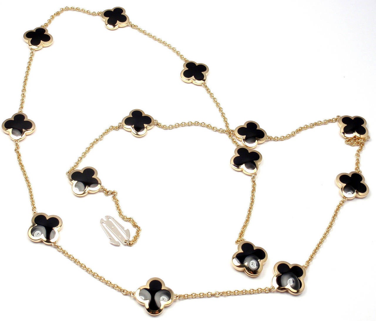 18k Yellow Gold Pure Alhambra Fourteen-Motif Black Onyx Necklace by 
Van Cleef & Arpels.
With 14 motifs of black onyx Pure Alhambra stones, 15mm each.

Details: 
Length: 32