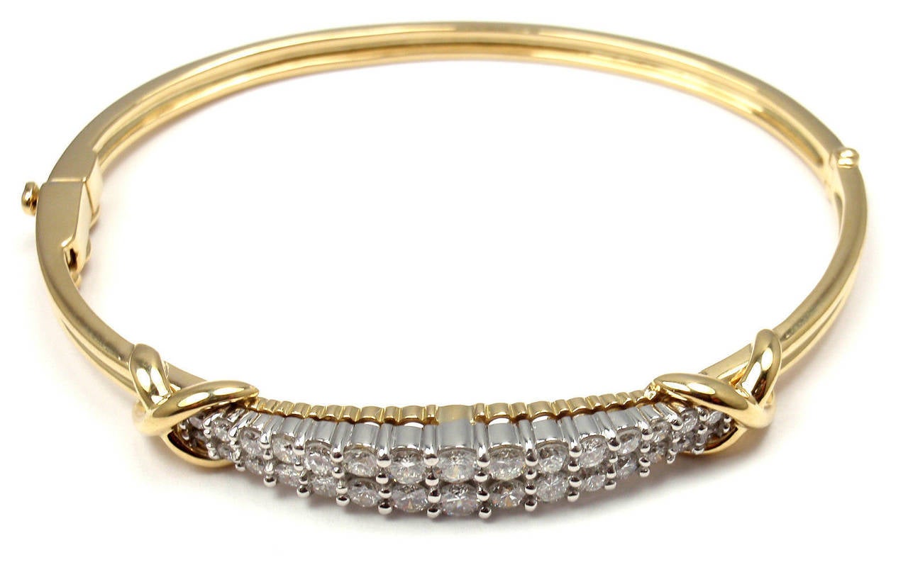 18k Yellow Gold Platinum Diamond Bangle Bracelet by Tiffany & Co. 
With 30 round brilliant cut diamonds VS1 clarity, 
E color 
Total weight approximately 3ct

Details: 
Weight: 23.3 grams
Length: 7