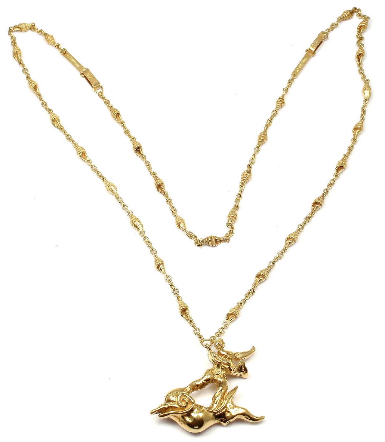 Limited Edition 18k Yellow Gold  Boy And Dolphin Bracelet Necklace Set by Salvador Dali.
This is a limited edition numbered piece from 1970's, number 102 out of 1000 ever made.

Details:
Length: Necklace 24