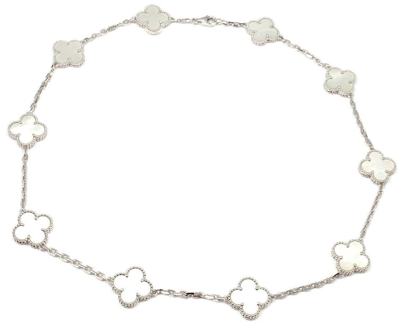 18k White Gold Alhambra 10 Motifs Mother Of Pearl Necklace by
Van Cleef & Arpels.
With 10 motifs of mother of pearl Alhambra stones 15mm each.
This necklace comes with Van Cleef & Arpels certificate.

Details:
Length: 16