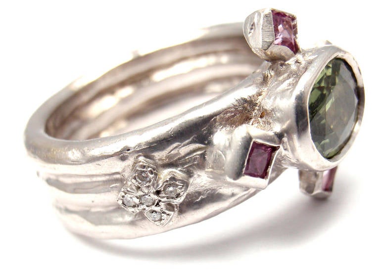 18k White Gold Diamond, Pink Sapphire and Alexandrite Ring by Loree Rodkin. With 10 diamonds total weight approx .10ct VS2 clarity, G color
 4 pink sapphires, 1 oval alexandrite 7mm x 10mm

Details: 
Size: 7
Weight: 14.7 grams
Width: