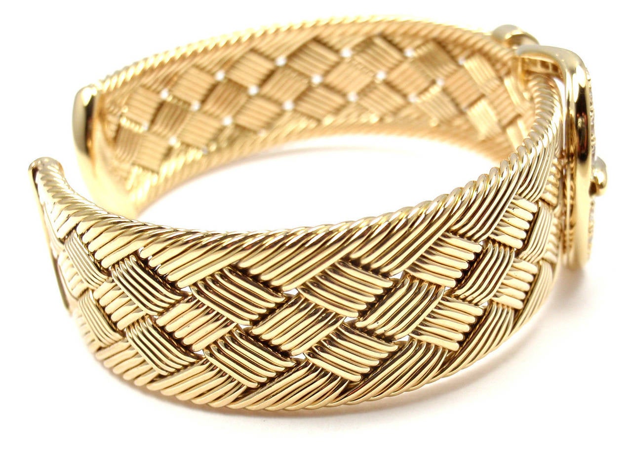 18k Yellow Gold Diamond Woven Buckle Cuff Bangle Bracelet by Hermes.
With 24 round brilliant cut diamonds VVS1 clarity, G color total weight approx. .85ct

Details:
Length: 7