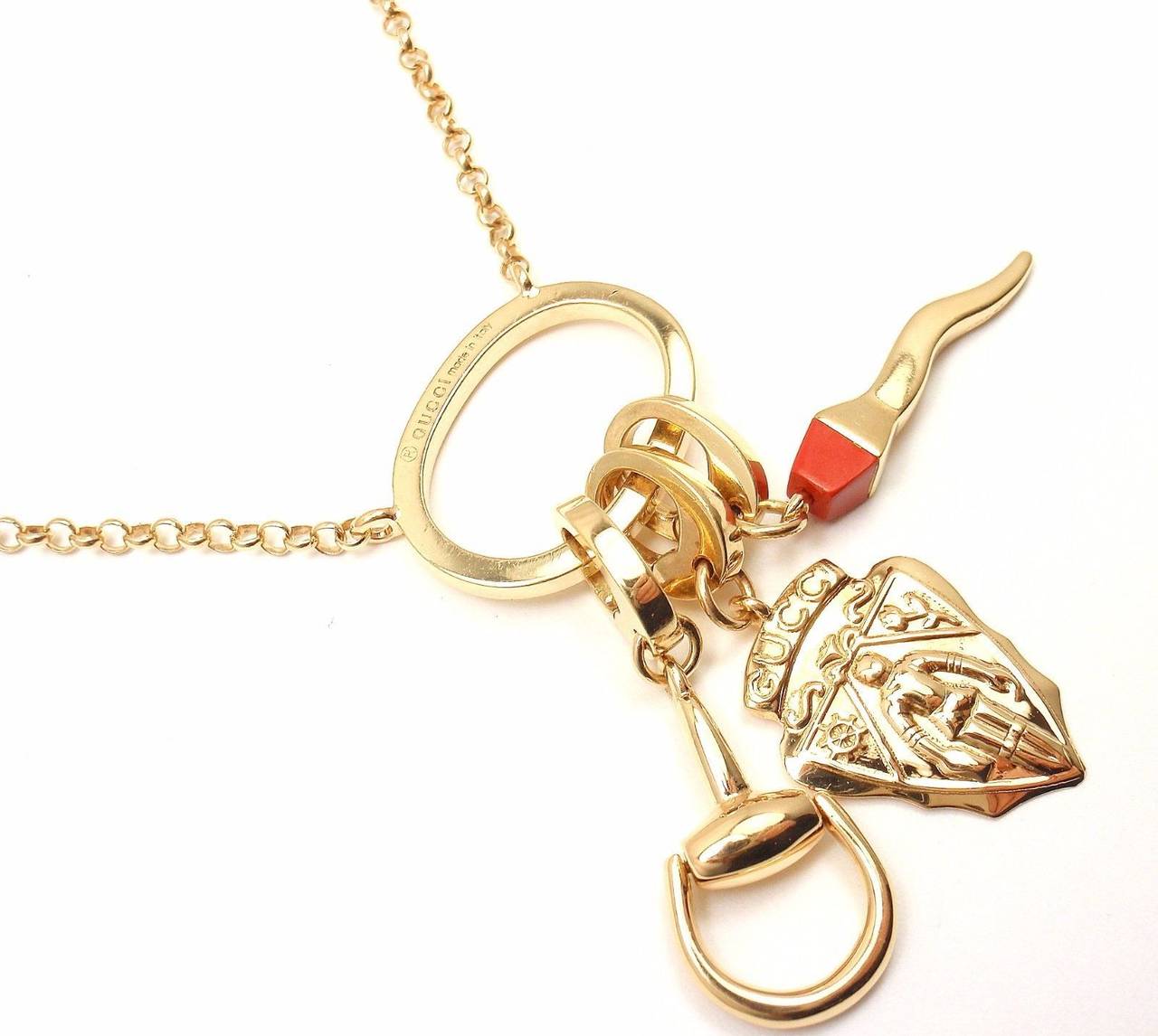 Gucci Coral Multi Charm Emblem Horsebit Gold Necklace In New Condition In Holland, PA