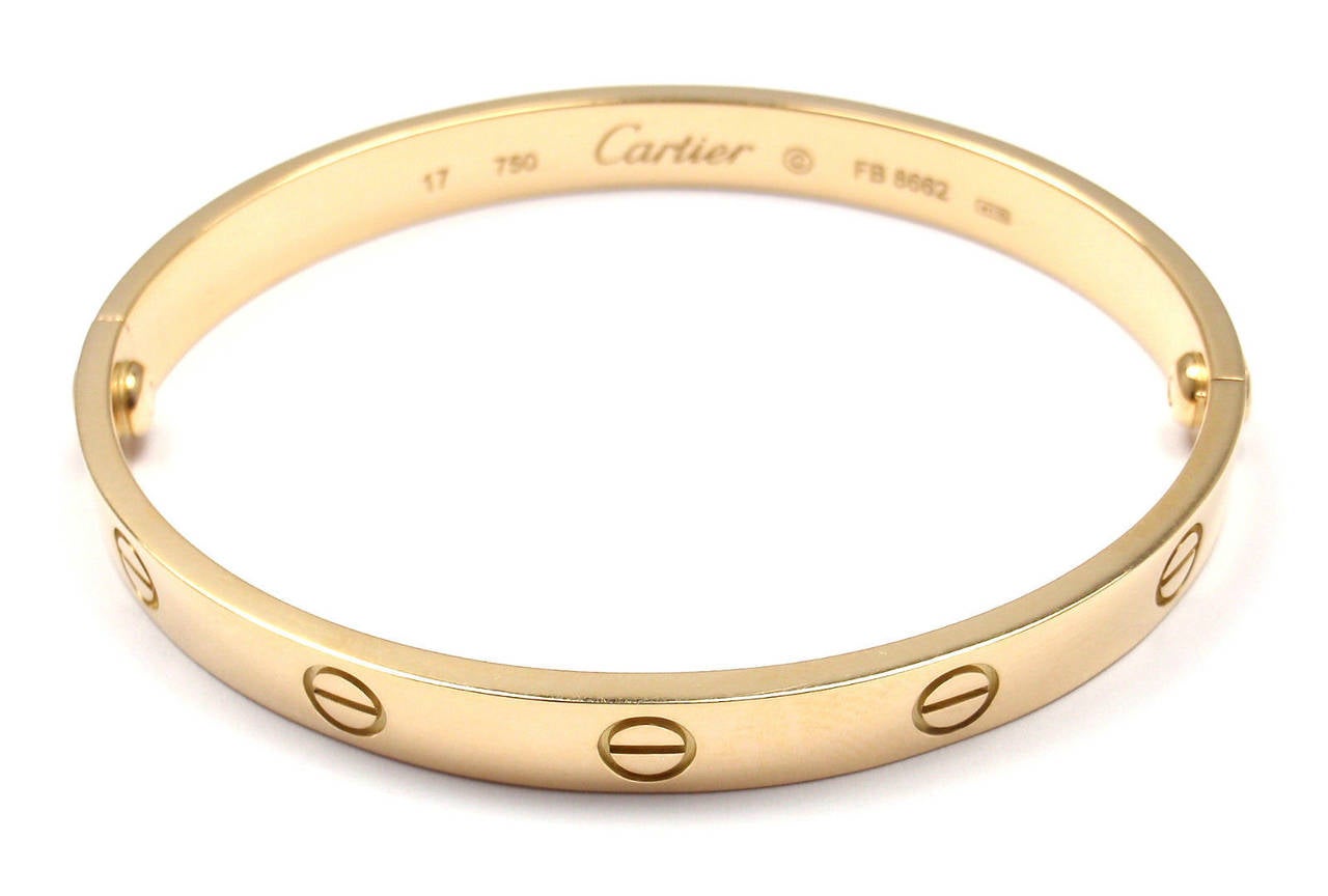 18k Yellow Gold LOVE Bangle Bracelet by Cartier. Size 17.

This beautiful Cartier Love Bangle comes with an original Cartier box
and a Screwdriver.

Details:
Weight: 32.4 grams
Width: 6.5mm
Stamped Hallmarks: Cartier 750 17 RE7547
*Free
