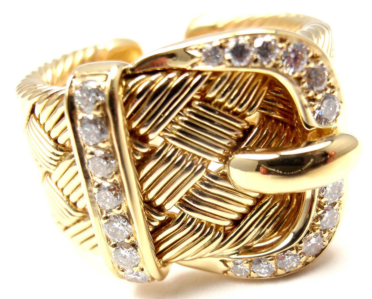 18k Yellow Gold Diamond Large Woven Buckle Ring by Hermes.
With 19 round brilliant cut diamonds VVS1 clarity G color 
total weight approx. .55ct

Details:
Ring Size: 7
Weight: 14.1 grams
Width: 16mm
Stamped Hallmarks: Hermes 750 22085 Made