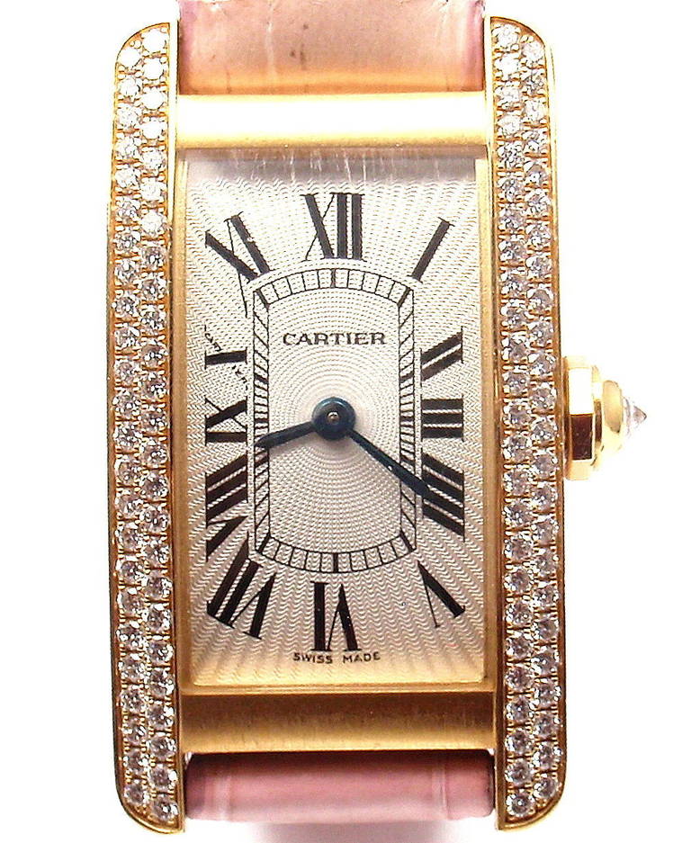 Cartier Lad'ys 18k yellow gold and diamond Tank Americaine wristwatch, Ref. 2482. Curved rectangular case with double row of diamonds on the sides 
and lugs. Cartier secret signature at X. Quartz movement and a cotton-candy pink leather strap with