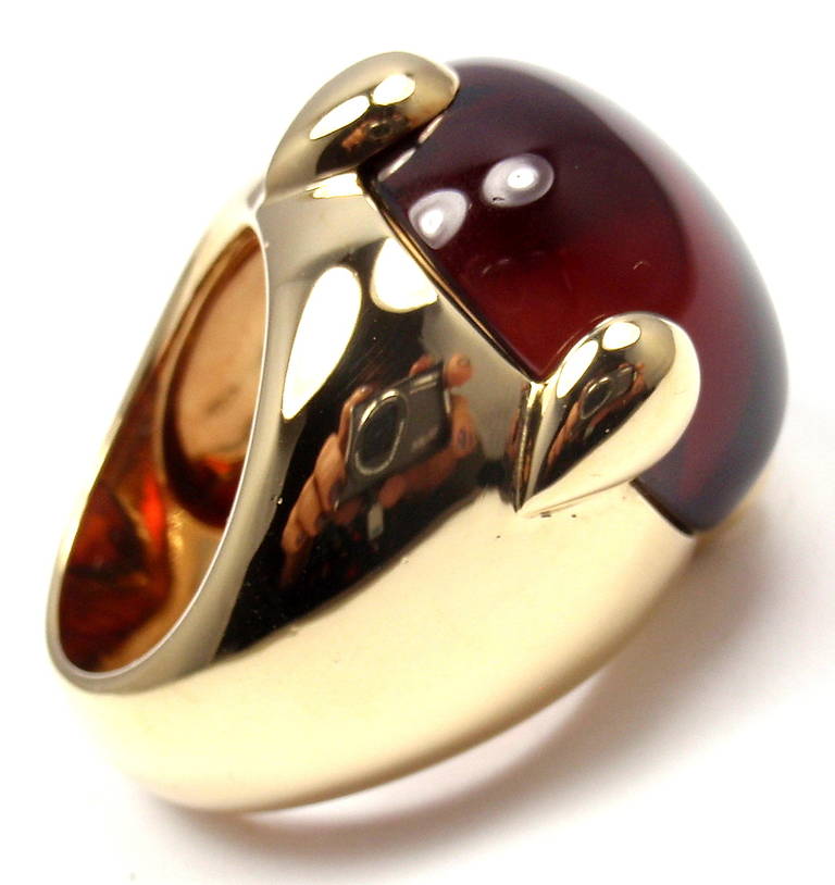 18k Yellow Gold Large Cabochon Garnet Ring by Pomellato. 
With one large 20mm cabochon garnet stone. 

Details: 
Weight: 25.1 grams
Ring Size: 6
Width: 25mm
Stamped Hallmarks: Pomellato 750 18k
*Free Shipping within the United