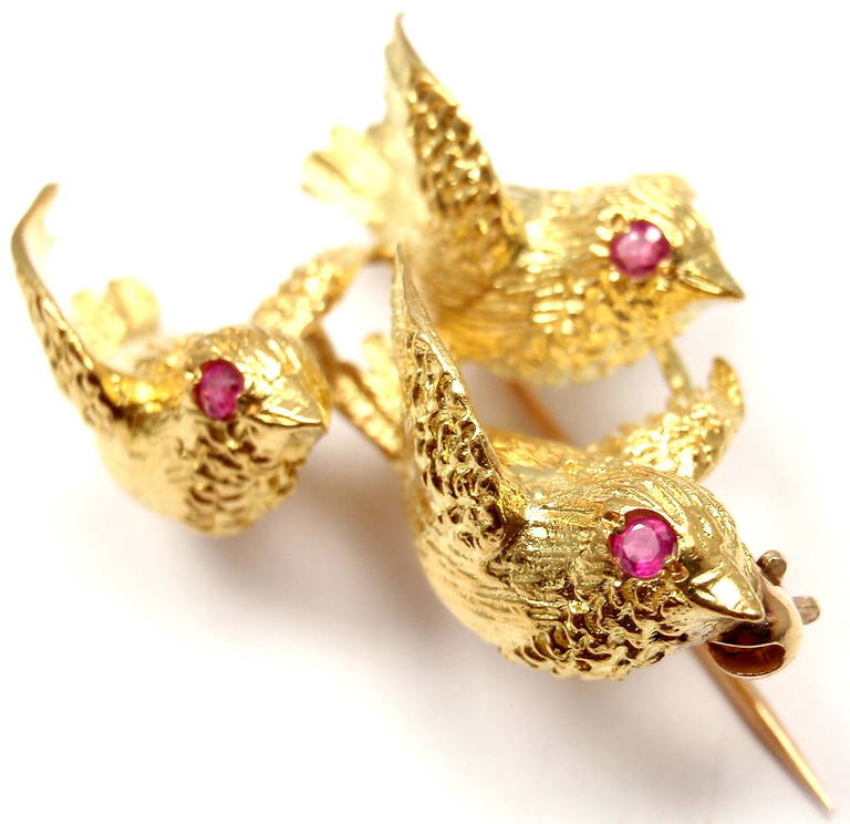 18k Yellow Gold Ruby Flying Birds Brooch Pin by Tiffany & Co. 
With 3 round ruby stones.

Details: 
Measurements: 1 1/4