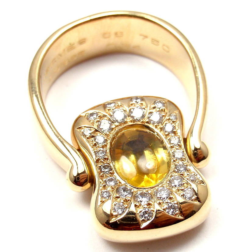 18k Yellow Gold Diamond, Yellow Sapphire, and Citrine Flip Ring by Hermes. With 35 round brilliant cut diamonds, VS1 clarity G color. Total Weight: .34ct. One oval citrine, total weight: 1ct. One oval yellow sapphire, total weight: 1ct.

Details: