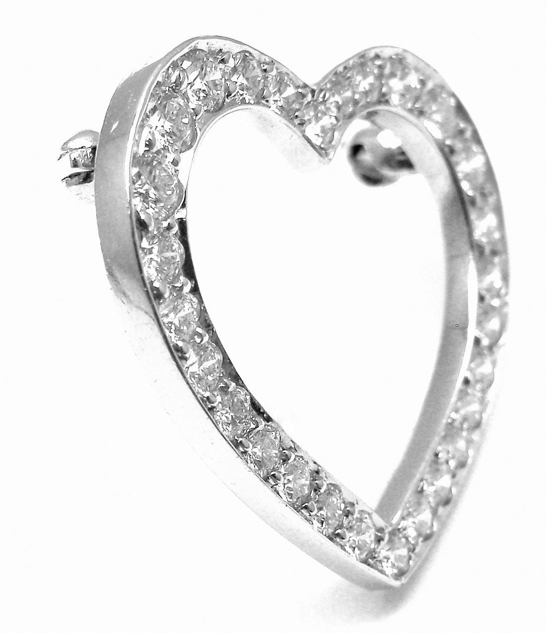 Platinum Tiffany & Co. Diamond Heart Brooch Pin.
With 29 round diamonds VS1 clarity, G color total weight approx. .80ct

Measurements: 24mm x 24mm
Weight: 5 grams
Stamped Hallmarks: Tiffany and Co PT950

*Shipping is Free inside the United