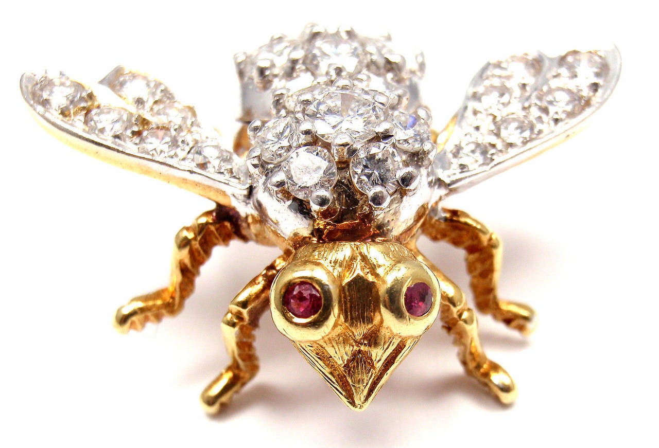 18k Yellow Gold Diamond Ruby Bee Pin Brooch by Herbert Rosenthal.
With 31 round brilliant cut diamonds VS1 clarity, G color total weight approx. 3ct

Details:
Measurements: 25mm x 31mm
Weight: 9.8 grams
Stamped Hallmarks: HR 18k
*Free