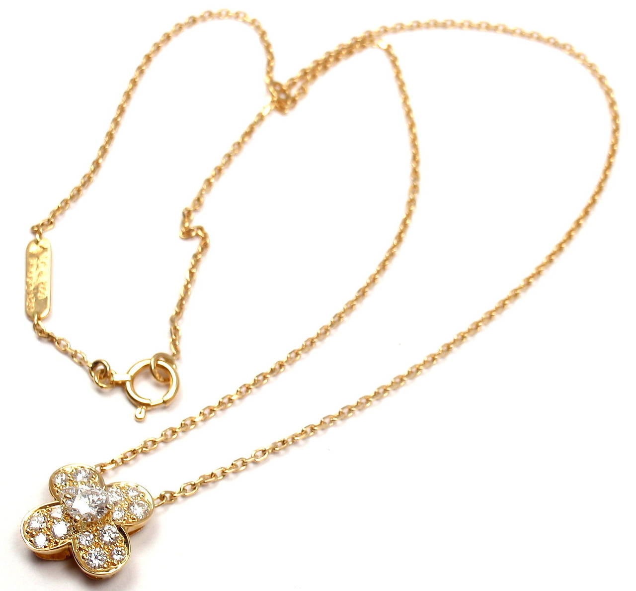 18k Yellow Gold Diamond Trefle Clover Alhambra Pendant Necklace by Van Cleef & Arpels.
With 17 brilliant round cut diamonds VVS clarity, F color
Total weight .50ctw

Details:
Length: 16'' necklace
Alhambra: 11mm x 11mm
Weight: 4.5