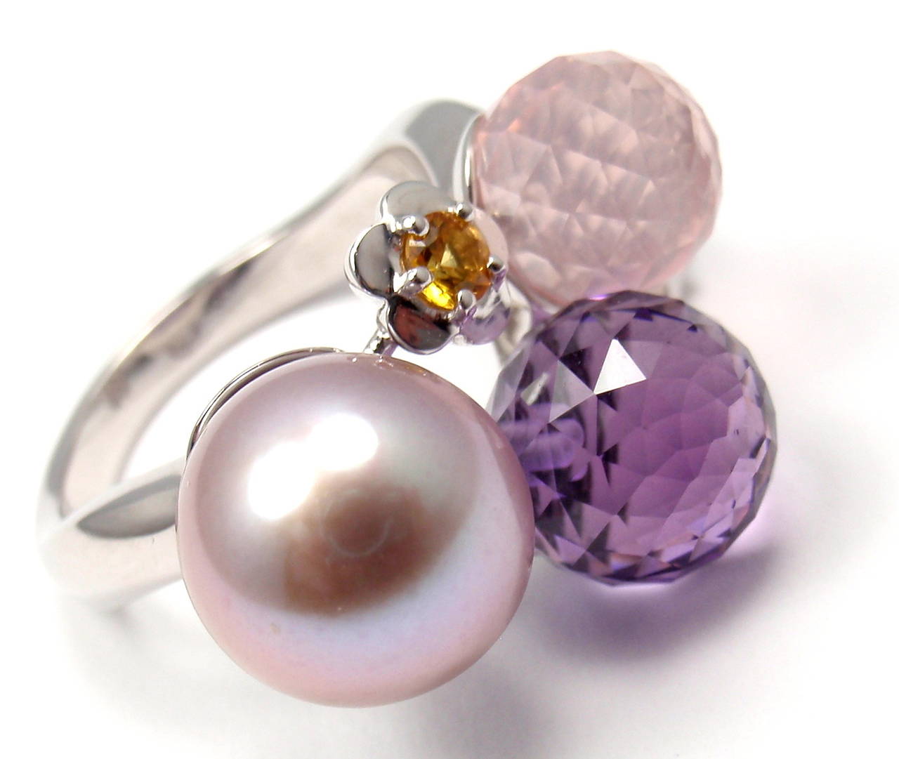 18k White Gold Amethyst Pearl Sapphire RIng by Chanel. 
With 1 x 11mm Grey Pearl
1 x 10mm Amethyst
1 x 10mm Pink Tourmaline
2 Sapphires (pink & yellow)

Details: 
Ring Size: Size: 6
Width:  15mm
Weight:  9.8 grams
Stamped Hallmarks: 