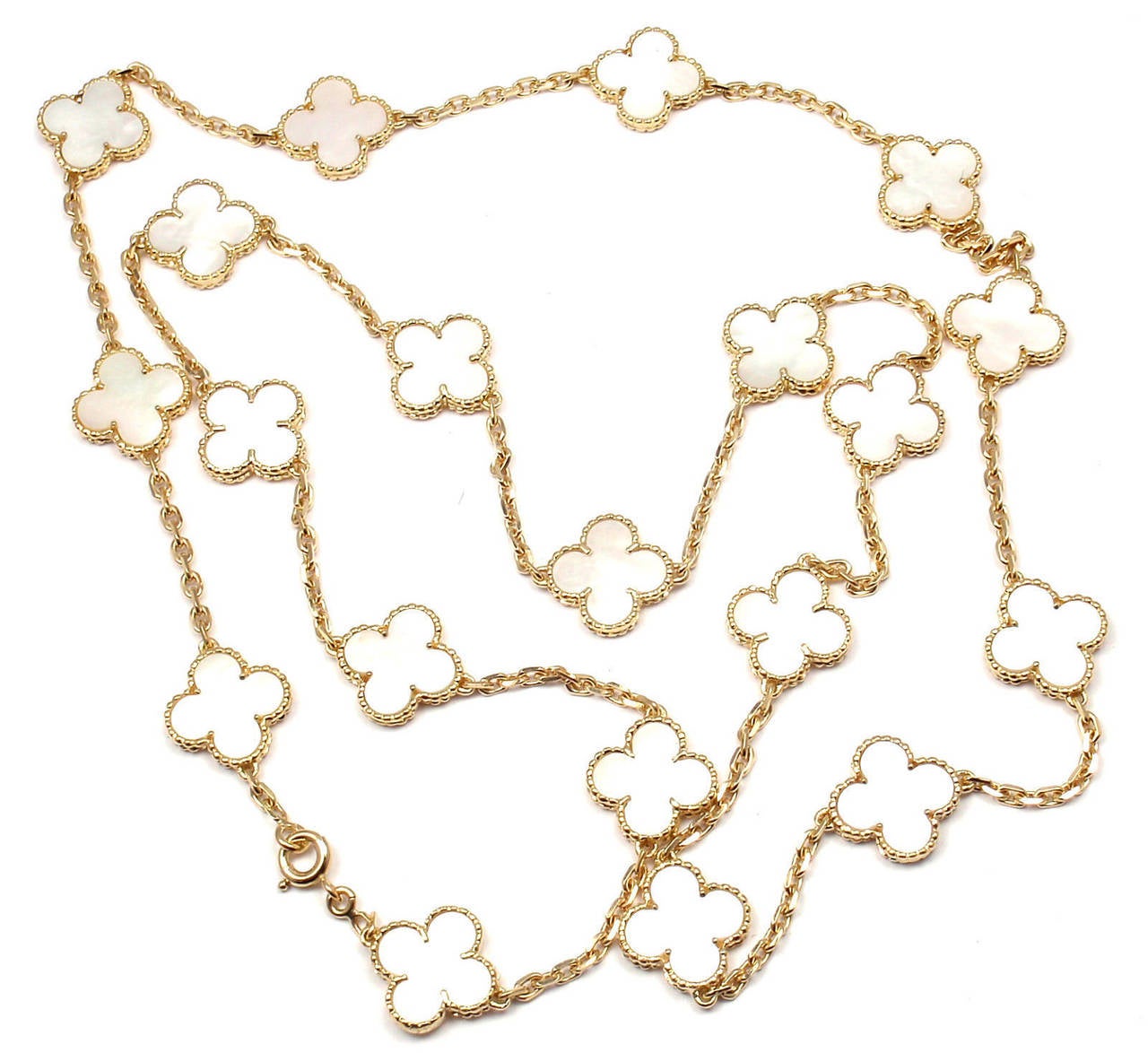 18k Yellow Gold Alhambra 20 Motifs Coral Necklace by Van Cleef & Arpels. 
With 20 motifs of mother of pearl alhambra stones 15mm each
This is an antique mother of pearl alhambra necklace from 1970's.

Details: 
Length:  31.5