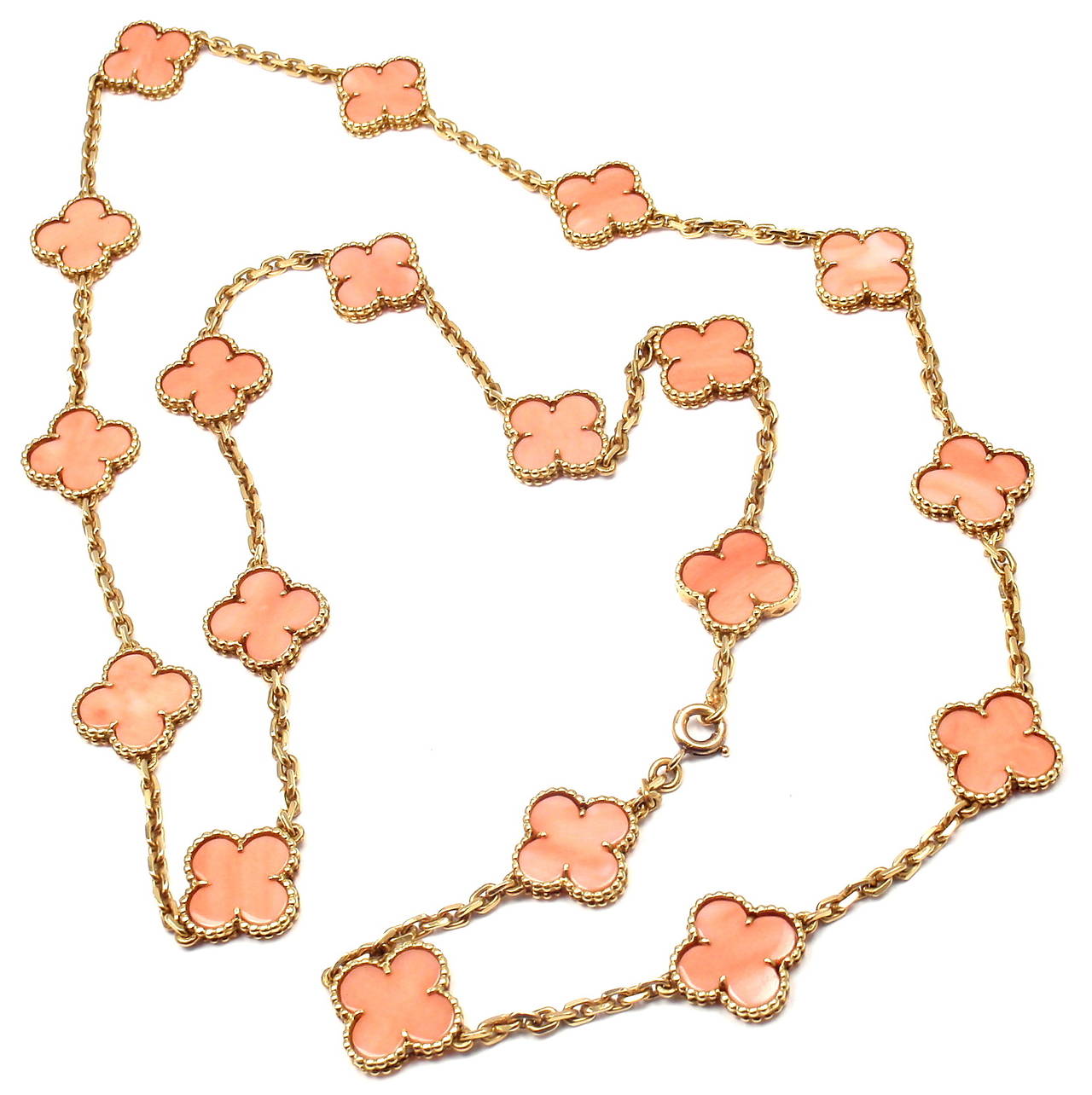 18k Yellow Gold Alhambra 19 Motifs Coral Necklace by Van Cleef & Arpels. 
With 19 motifs of coral alhambra stones 15mm each
This is one of a kind Van Cleef & Arpels antique coral alhambra necklace from 1960's.

Details: 
Length: 29.5