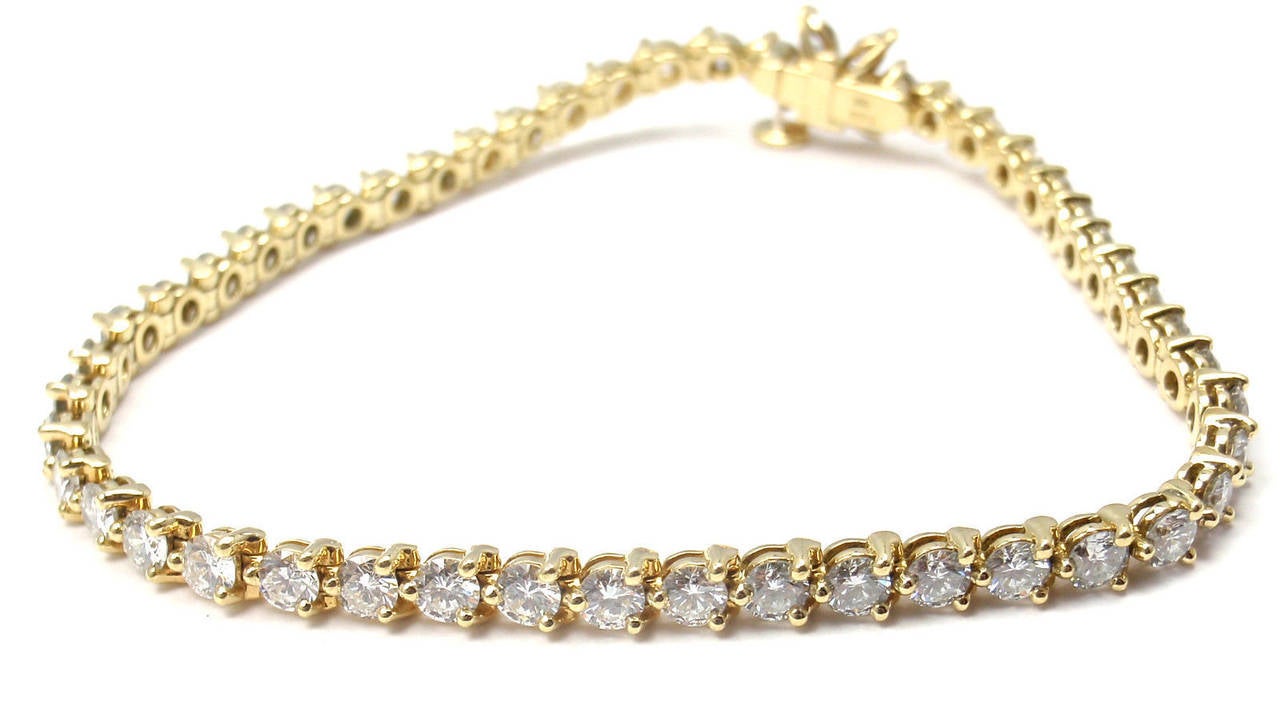 18k Yellow Gold Diamond Line Bracelet by Tiffany & Co from Victoria collection.
With 48 round brilliant cut diamonds VS1 clarity,
G color 
Total weight approximately 4.56ct
4 marquise diamonds VS1 clarity, G color total weight approx.