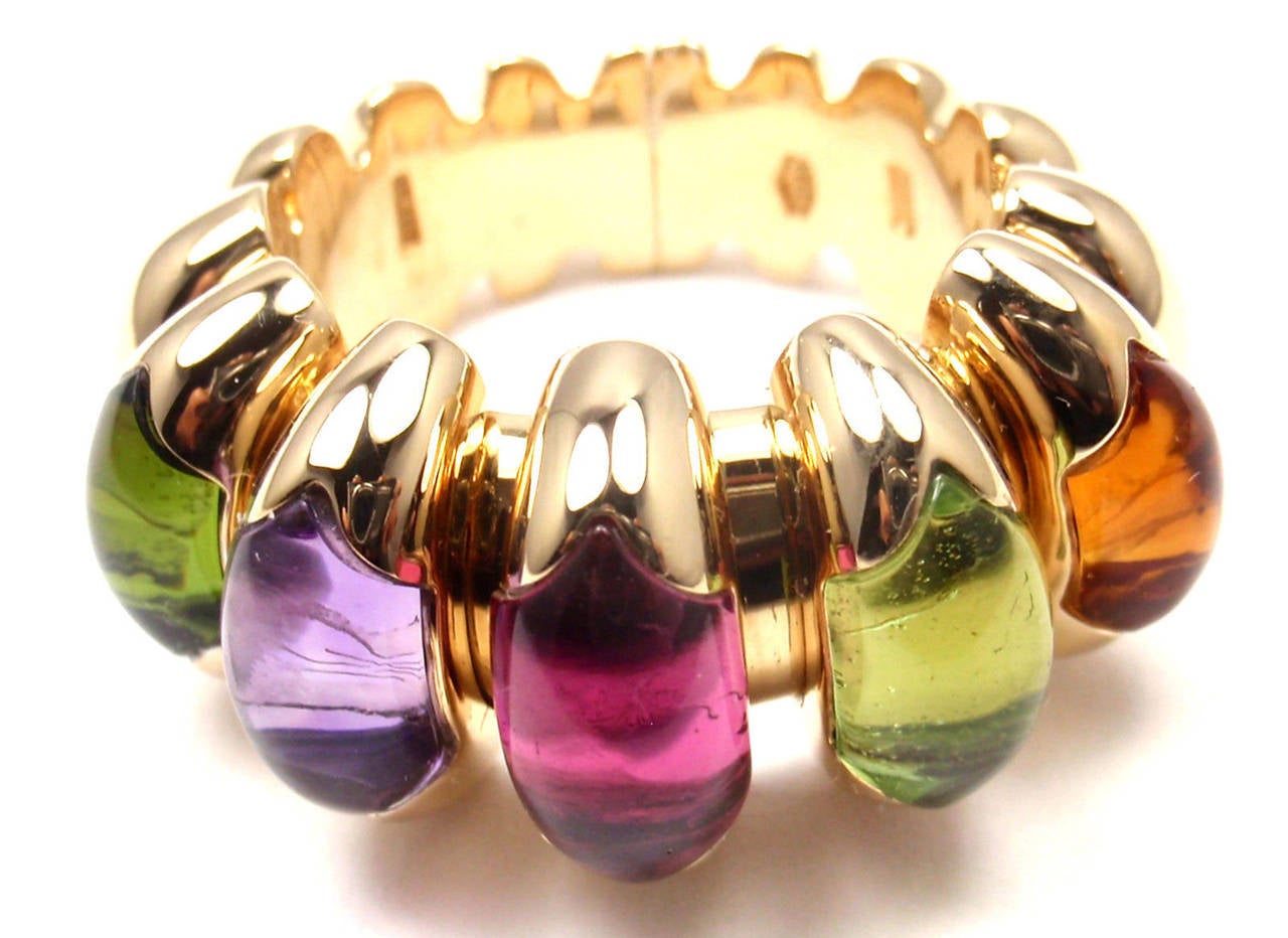 18k Yellow Gold Ctirine, Peridot, Pink Tourmaline, Amethyst, Green Tourmaline Celtaura Ring By Bulgari. 
With 1 Oval Pink Tourmaline 7mm x 10mm
1 Oval Aquamarine 7mm x 10mm

Details:
Ring Size: 6 
Width: 13mm
Weight: 20.8 grams
Stamped