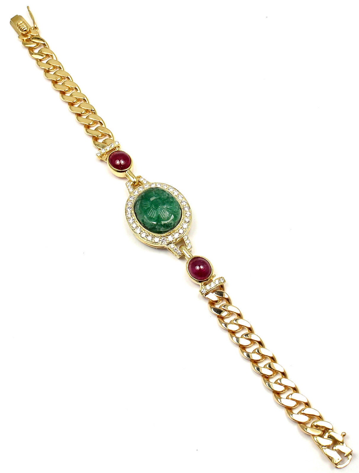 18k Yellow Gold Diamond, Carved Emerald & Ruby Bracelet by Van Cleef & Arpels. 
With 50 brilliant round cut diamond VVS1 clarity, e color
Total weight approx. 1ct
2 rubies total weight approx. 1ct
1 Large Carved emerald 15mm x 13mm x 6.7mm
